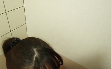 Naughty Schoolgirl Can't Get Enough of Public Toilet Action