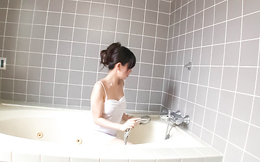 Manami Komukai sucks dick in the bathtub