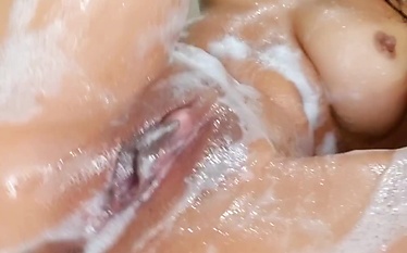 In a jacuzzi getting very wet