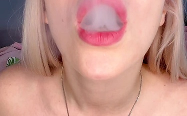 Smoking with a glass dildo in pussy