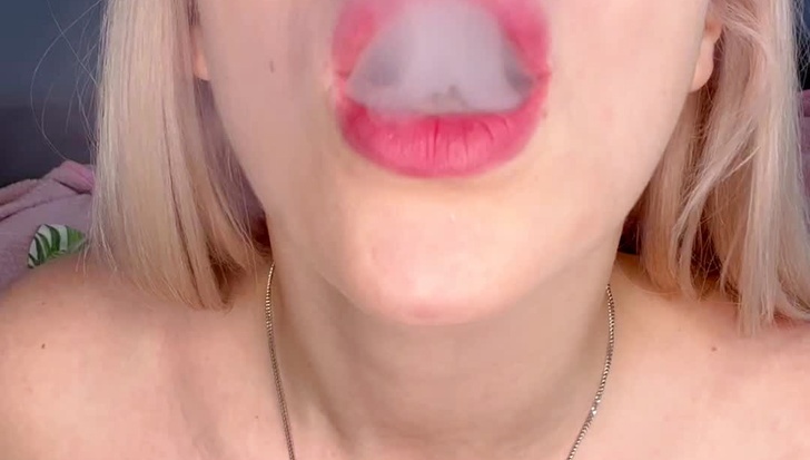 Smoking with a glass dildo in pussy