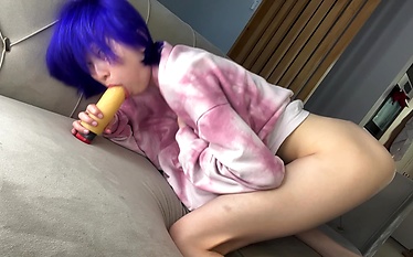 The kitty  playfully jumps on dildo