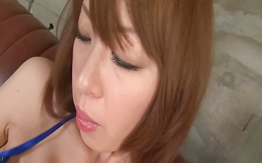 Pretty babe Misato Sakurai teasing and getting naked in her micro bikini